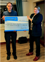 Richmond Rotary President Emma Fulton presenting the cheque for £500 to Andy Wilson of Yorkshire Cancer research